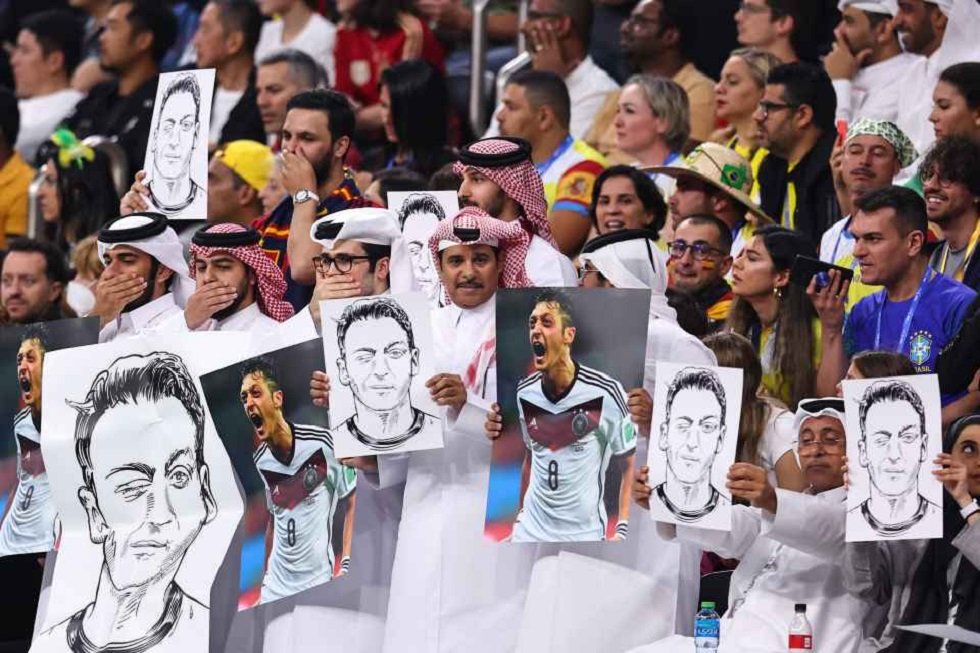 Mesut Ozil: Here’s Why Qatar Men Are Holding A Hand Over Their Face ...